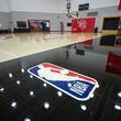 The NBA logo is shown on the main court at the practice facility in the Brookhaven area, Thursday, May 16, 2024, in Atlanta. The Atlanta Hawks are giving us access to the areas of the practice facility that are not accessible and areas fans would never see. The areas to be photographed, Main court, locker room, weight room, kitchen, player film room, upstairs conference room, and TV studiio. (Jason Getz / AJC)
