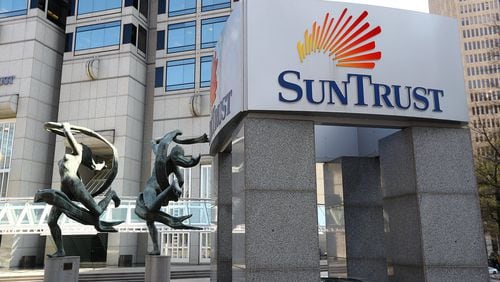 SunTrust and BB&T won Justice Department approval this week by agreeing to sell 28 branches. Two of the branches are in Georgia.