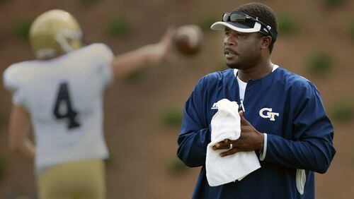 Former Georgia Tech star quarterback Joe Hamilton watches the wide receivers during Georgia Tech football practice while he worked in the football team’s recruiting office. JOHNNY CRAWFORD / JCRAWFORD@AJC.COm