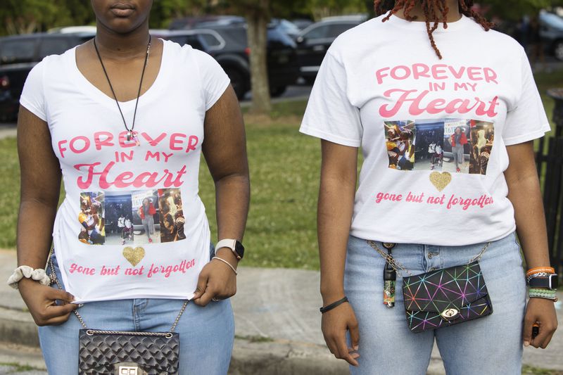 Najah White (right) and Star White (left) show off custom-made t-shirts during an event honoring shooting victim Bre'Asia Powell on Wednesday, May 31, 2023, at the C.T. Martin Natatorium and Recreation Center in Atlanta. Powell was killed on Memorial Day weekend at a gathering at Benjamin E. Mays High School, which she attended. CHRISTINA MATACOTTA FOR THE ATLANTA JOURNAL-CONSTITUTION.