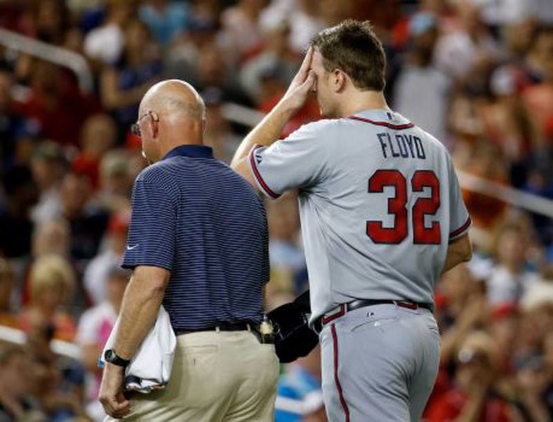 Gavin Floyd leaves game after fracturing pitching elbow Thursday. The swelling was already visible on his right elbow in this picture. (AP photo)