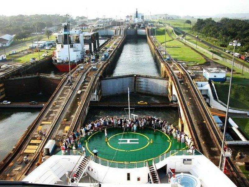 A ship squeezes into a lock on the Panama Canal.