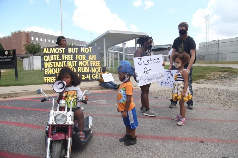Kawan Ward, 2, leads Black Lives Matter chants in a megaphone as protesters gather in front of the Clayton County Jail in Jonesboro on Sunday, September 13, 2020. (Photo: Steve Schaefer for The Atlanta Journal-Constitution)