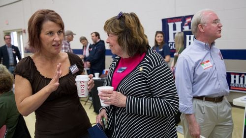 State Rep. Betty Price, center, talks with Meredith Pierard as Price’s husband, former U.S. Rep. Tom Price, stands nearby during this month’s 6th Congressional District BBQ Roundup in Roswell. STEVE SCHAEFER / SPECIAL TO THE AJC