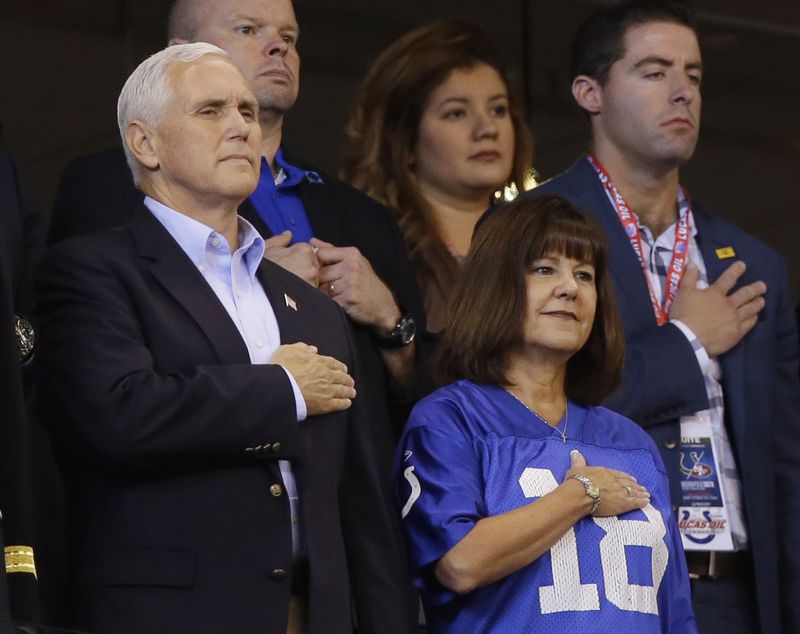 Vice President Mike Pence and his wife, Karen, stand during the playing of the national anthem before the NFL football game between the Indianapolis Colts and the San Francisco 49ers, on Sunday, Oct. 8, 2017, in Indianapolis.