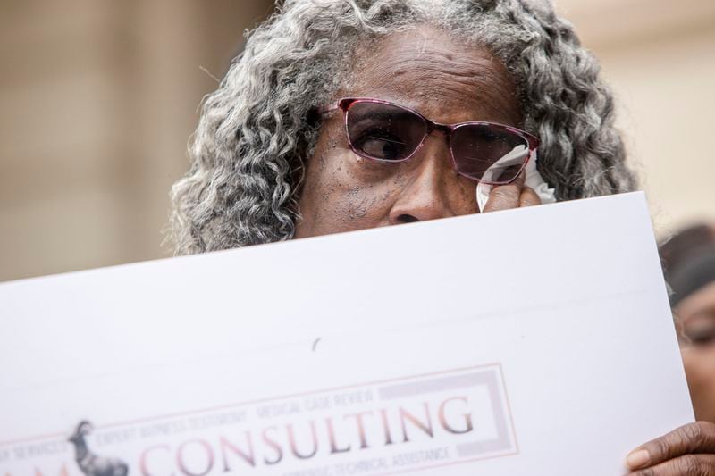 Mamie Norman, aunt of Lashawn Thompson, holds results from his autopsy on Monday, May 22, 2023, at the State Capitol in Atlanta. Thompson’s family and legal team released the results of an autopsy that determined his death in the psychiatric wing of the Fulton County Jail resulted from neglect. Christina Matacotta for The Atlanta Journal-Constitution. 