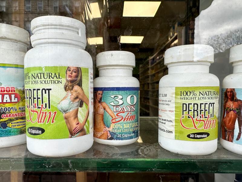 Capsules advertising weight loss properties are displayed at a store in New York, Thursday, April 25, 2024. It's now illegal to sell weight loss and muscle-building supplements to minors in New York. The first-in-the-nation law went into effect this week. (AP Photo/Seth Wenig)