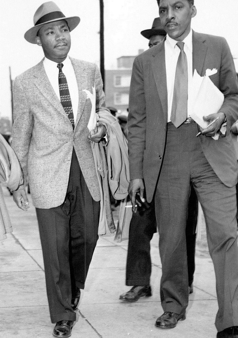 A new statue of Martin Luther King Jr. planned for the Georgia Capitol will be based on this historic photo of King walking with Bayard Rustin and Ralph David Abernathy (not seen here) leaving the Montgomery County Courthouse after an arraignment during the Montgomery Bus Boycott on Feb. 24, 1956. (AP photo)