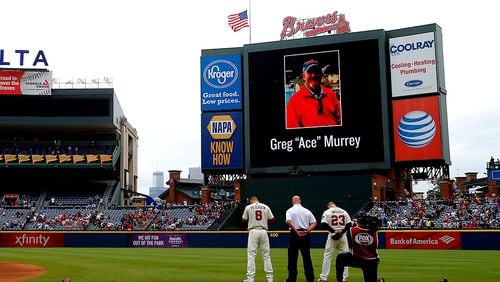 ATLANTA, GA - AUGUST 30: An American flag is lowered to half-staff in memory of a fan, Greg "Ace" Murrey, who fell to his death at the game between the Atlanta Braves and the New York Yankees on August 29, 2015, at Turner Field in Atlanta.