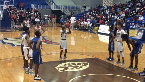 Tri-Cities guard Titus Hunter (4) was 9-for-13 from the free-throw line and finished with 28 points in the Bulldogs' 83-74 victory over Brunswick in the Class AAAAAA semifinals Saturday at the University of West Georgia.