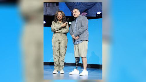 Metro Atlanta resident Erik Pimentel and Oprah Winfrey appeared on stage together when Oprah’s 2020 Vision: Your Life in Focus tour came to State Farm Arena on Saturday, January 25, 2019. During his appearance, Pimentel also met Dwayne Johnson, whom he considers an inspiration. (Photo: Courtesy of WW, George Burns)