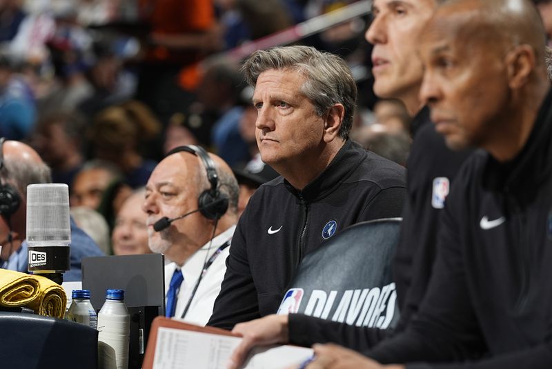 Minnesota Timberwolves head coach Chris Finch, center, looks on from the bench in the first half of an Game 1 of an NBA basketball second-round playoff series against the Denver Nuggets, Saturday, May 4, 2024, in Denver. (AP Photo/David Zalubowski)