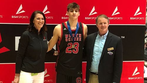 (L-R) Carly Klingler, regional sales manager for Slam Dunk sponsor BSN, North Oconee dunk champion Wilson Sibley and GHSA Executive Director Robin Hines