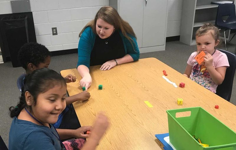 These kindergarten students learn math principles as part of Gwinnett County's Math Institute. ERIC STIRGUS / ESTIRGUS@AJC.COM