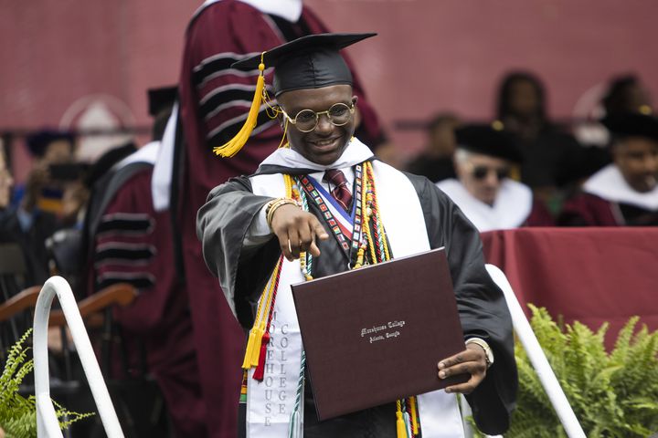Hasani Comer smiles as he exits the stage with his degree during the Morehouse College commencement ceremony on Sunday, May 21, 2023, on Century Campus in Atlanta. The graduation marked Morehouse College's 139th commencement program. CHRISTINA MATACOTTA FOR THE ATLANTA JOURNAL-CONSTITUTION