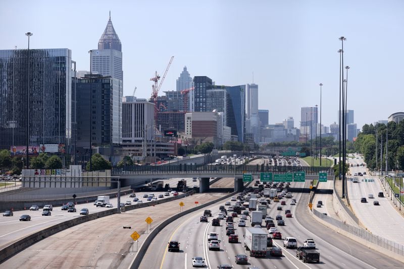 061722 Atlanta: Automobiles travel along the I-75 / I-85 connector shown from the 17th street bridge Thursday, June 16, 2022, in Atlanta. (Jason Getz / Jason.Getz@ajc.com)