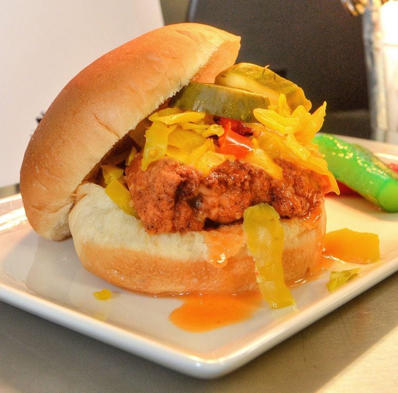 This hand-breaded free-range fried chicken sandwich, with Doux South chow chow and honey hot sauce, will be served at the West Nest in Section 324 at Mercedes-Benz Stadium. The West Nest is operated by local nonprofit Westside Works, which creates employment and job training for residents of Atlanta’s Westside community. CHRIS HUNT / SPECIAL