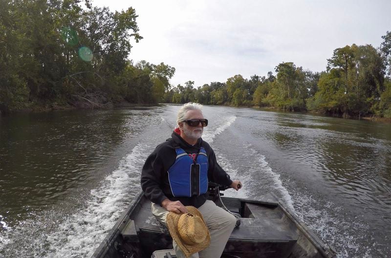 Gordon Rogers, executive director of Flint Riverkeeper, drives a boat on the Flint River near the Decatur-Mitchell County line on October 17, 2019. (Hyosub Shin / Hyosub.Shin@ajc.com)