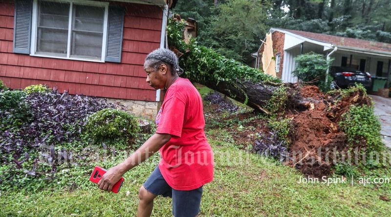 Jacqueline Slaton said a falling tree busted windows and cracked the walls of her Laurelwood Drive rental home, forcing her, her husband and her 89-year-old mother to evacuate Monday morning.