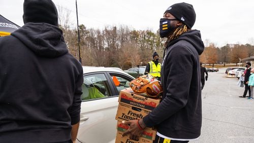 Braves pitcher Touki Toussaint took part in an event sponsored by the Players Alliance to distribute food during the pandemic.