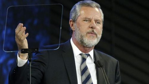 Liberty University President Jerry Falwell Jr. apologized Monday for a tweet that included a racist photo that appeared on Gov. Ralph Northam's medical school yearbook page decades ago.