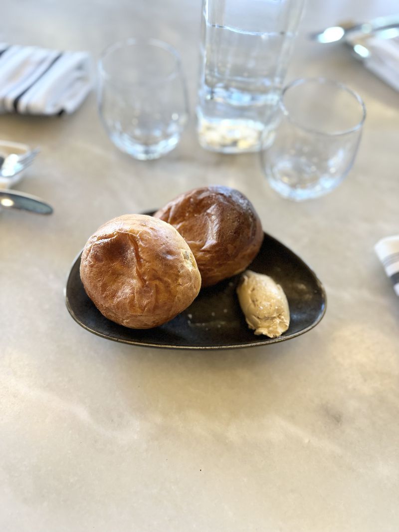 Bread & Butterfly's airy plantain brioche buns are delicious with a smear of cane syrup butter or dipped into sauces you'll find on the dinner menu. Courtesy of Bread & Butterfly