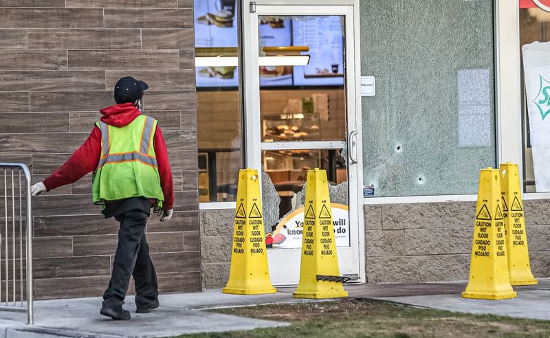 Bullet holes could also be seen in shattered windows at a McDonald's on Fulton Industrial Boulevard.