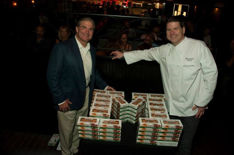 Marlow's Tavern currently has 15 locations in metro Atlanta and five in Orlando and Tampa, Florida. Here are co-founders Tom DiGiorgio and John Metz at the opening of a Florida Marlow's Tavern location in 2013. (Courtesy of Marlow's Tavern)