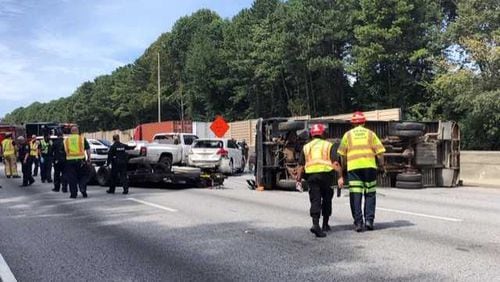 I-75 South was temporarily shut down Tuesday afternoon after a truck overturned in Clayton County, police said.