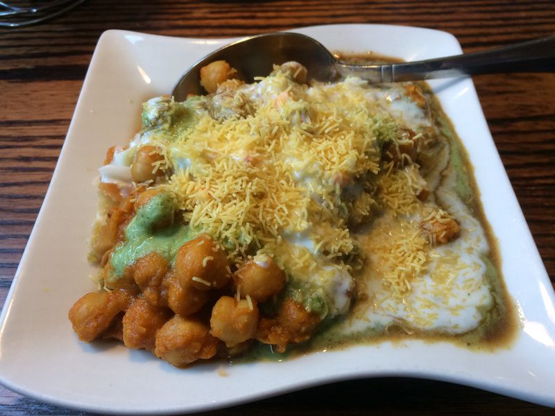 Pinch of Spice in Kennesaw offers some classic street food like this samosa chaat as appetizers. CONTRIBUTED BY WENDELL BROCK