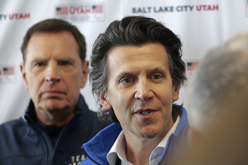 Christophe Dubi, Olympic Games Executive Director, right, speaks to the media Wednesday, April 10, 2024, in Salt Lake City. Salt Lake City's enduring enthusiasm for hosting the Olympics was on display, when members of the International Olympic Committee came to Utah during a site visit ahead of a formal announcement expected this July to name Salt Lake City the host for the 2034 Winter Olympics. (AP Photo/Rick Bowmer)