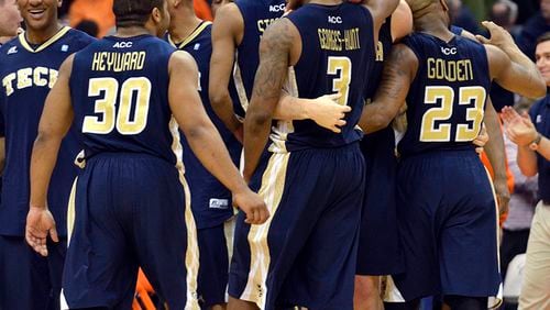 Georgia Tech players celebrate after defeating Syracuse 67-62 in an NCAA college basketball game in Syracuse, N.Y., Tuesday, March 4, 2014. (AP Photo/Kevin Rivoli) Georgia Tech players celebrate after upsetting No. 7 Syracuse, 67-62, Tuesday in Syracuse, N.Y. (Kevin Rivoli / AP)