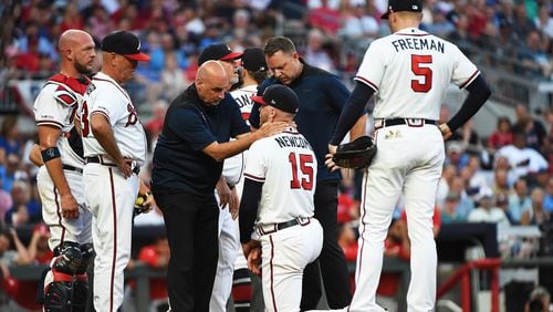 The Braves’ Sean Newcomb is attended to by training staff after being hit by a line drive during a game against the Philadelphia Phillies at SunTrust Park on Saturday.