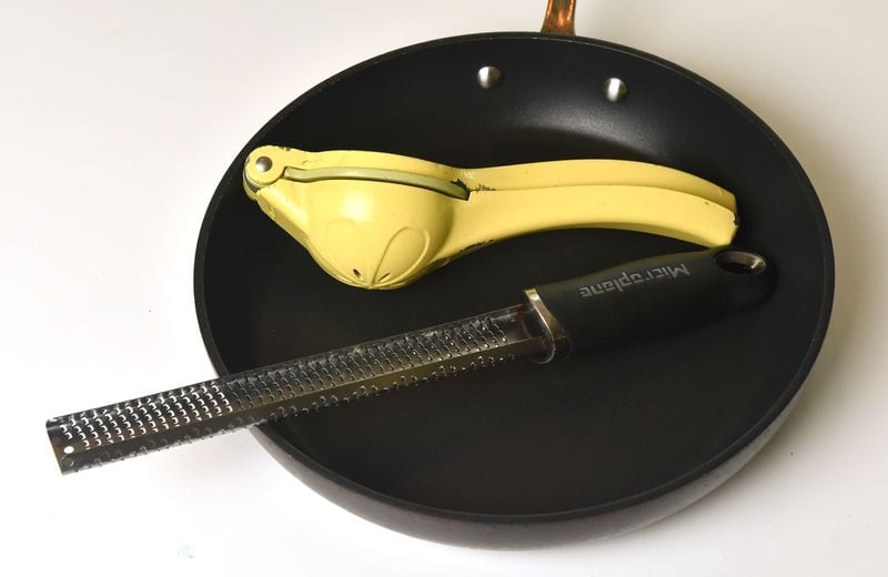 Three kitchen items that are always in chef Pat Pascarella's home are a nonstick pan, a Microplane (grater), and a citrus squeezer. (Chris Hunt for the AJC)
