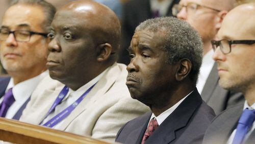 Dr. Arthur Ferdinand (second from right), Fulton County Tax Commissioner, continues to collect property tax money. Property taxes are due Monday. BOB ANDRES /BANDRES@AJC.COM AJC FILE PHOTO