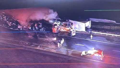 Crews shut down the ramp from I-75 South to I-285 West after a tractor-trailer crashed and burst into flames Thursday morning.