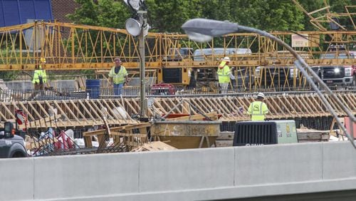 The I-85 bridge will reopen in time for Monday morning’s rush hour, state officials say. JOHN SPINK/JSPINK@AJC.COM