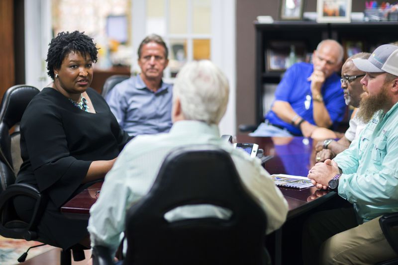 Georgia Democratic gubernatorial candidate Stacey Abrams meets with a group of employees at the Coastal Solar office during a campaign stop to announce her "Jobs for Georgia Plan” in July in Hinesville. (AP Photo/Stephen B. Morton)
