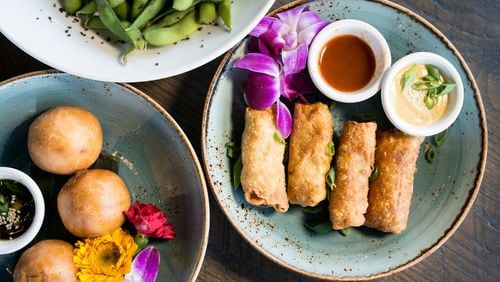 One Rooster Mongolian Bar appetizers include edamame with black lava sea salt, egg rolls, and crispy char siu park bao. Photo credit- Mia Yakel