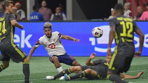 August 1, 2018 Atlanta -  MLS All-Stars forward Josef Martinez (17) gets tackled by Juventus defender Andrea Barzagli (15) in the first half of the Major League Soccer All-Star Game at the Mercedes-Benz Stadium on Wednesday, August 1, 2018. HYOSUB SHIN / HSHIN@AJC.COM