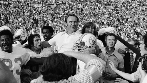 In this Jan. 14, 1973 file photo, Miami Dolphins coach Don Shula is carried off the field after his team won the Super Bowl game with a 14-7 victory over Washington, in Los Angeles. The Dolphins team that achieved the only perfect season in NFL history will be honored by the White House next Tuesday, Aug. 20, 2013, more than 40 years after its accomplishment. (AP Photo/File)