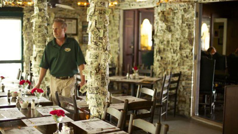 The historic restaurant on Cabbage Key includes thousands of one-dollar bills signed and taped to the walls by previous guests. (Jenny Drew Photography)