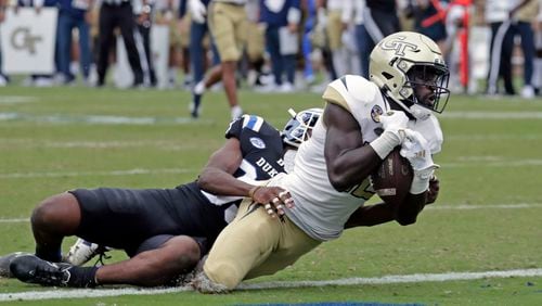 Georgia Tech wide receiver Adonicas Sanders (12) hauls in a pass for what proved to be the winning touchdown against Duke cornerback Jeremiah Lewis (39) during the second half of an NCAA college football game in Durham, N.C., Saturday, Oct. 9, 2021. (AP Photo/Chris Seward)