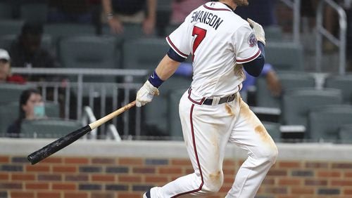 Braves shorstop Dansby Swanson drives in the game-winning run with a base hit against Padres on April 17. (Curtis Compton/Atlanta Journal-Constitution via AP)