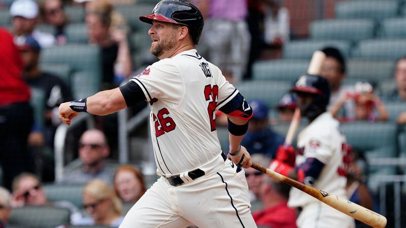Braves new catcher Stephen Vogt follows through on a single in the fourth inning against the Tampa Bay Rays on Sunday, July 18, 2021, at Truist Park in Atlanta. (John Bazemore/AP)