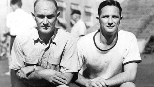 Mack Tharpe, left, poses with Bobby Dodd, right, during their tenure as assistant coaches to William Alexander at Georgia Tech. Alexander, in fact, is visible in the background of the photo between Tharpe and Alexander. (Georgia Tech archives)
