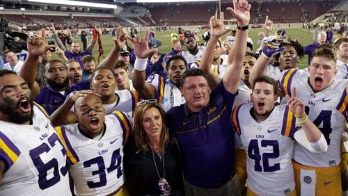 LSU coach Ed Orgeron celebrates with players after an NCAA college football game against Texas A&amp;M, Thursday, Nov. 24, 2016, in College Station, Texas. (AP Photo/David J. Phillip)