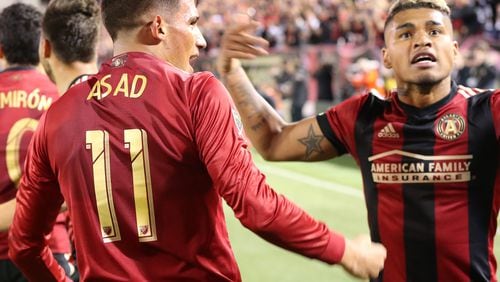 March 5, 2017, Atlanta: Atlanta United Yamil Asad (left) and Josef Martinez celebrate after Asad scores against the N.Y. Red Bulls during their first game in franchise history on Sunday, March 5, 2017, in Atlanta.   Curtis Compton/ccompton@ajc.com