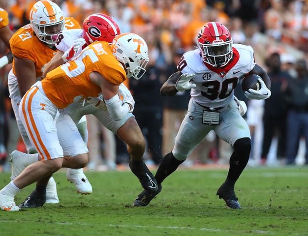 Georgia running back Daijun Edwards picks up yardage against Tennessee during the first half in a NCAA college football game on Saturday, Nov. 18, 2023, in Knoxville.  Curtis Compton for the Atlanta Journal Constitution