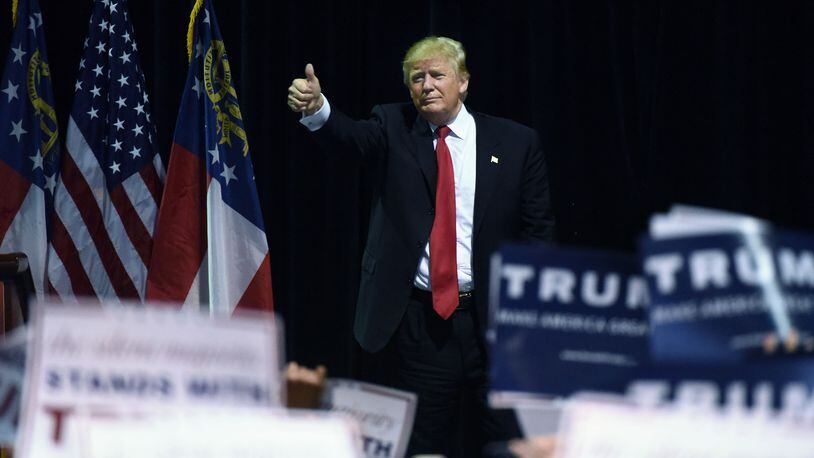 Republican frontrunner Donald Trump gives the thumbs up after his February speech at Georgia World Congress Center in Atlanta. Hyosub Shin, hshin@ajc.com